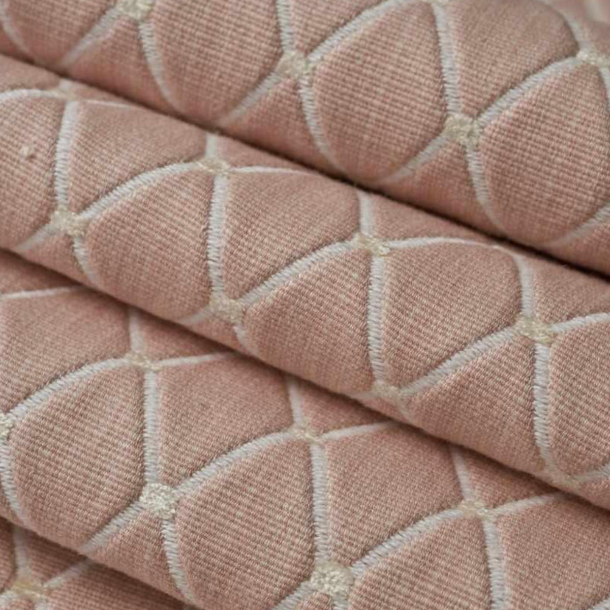 This stunning fabric in soft pink features a beautiful diamond repeat throughout. As featured on our Bronte Bed.  Width: 137.16 cm 93% Cotton, 7% Rayon  Application: Beds and bedheads