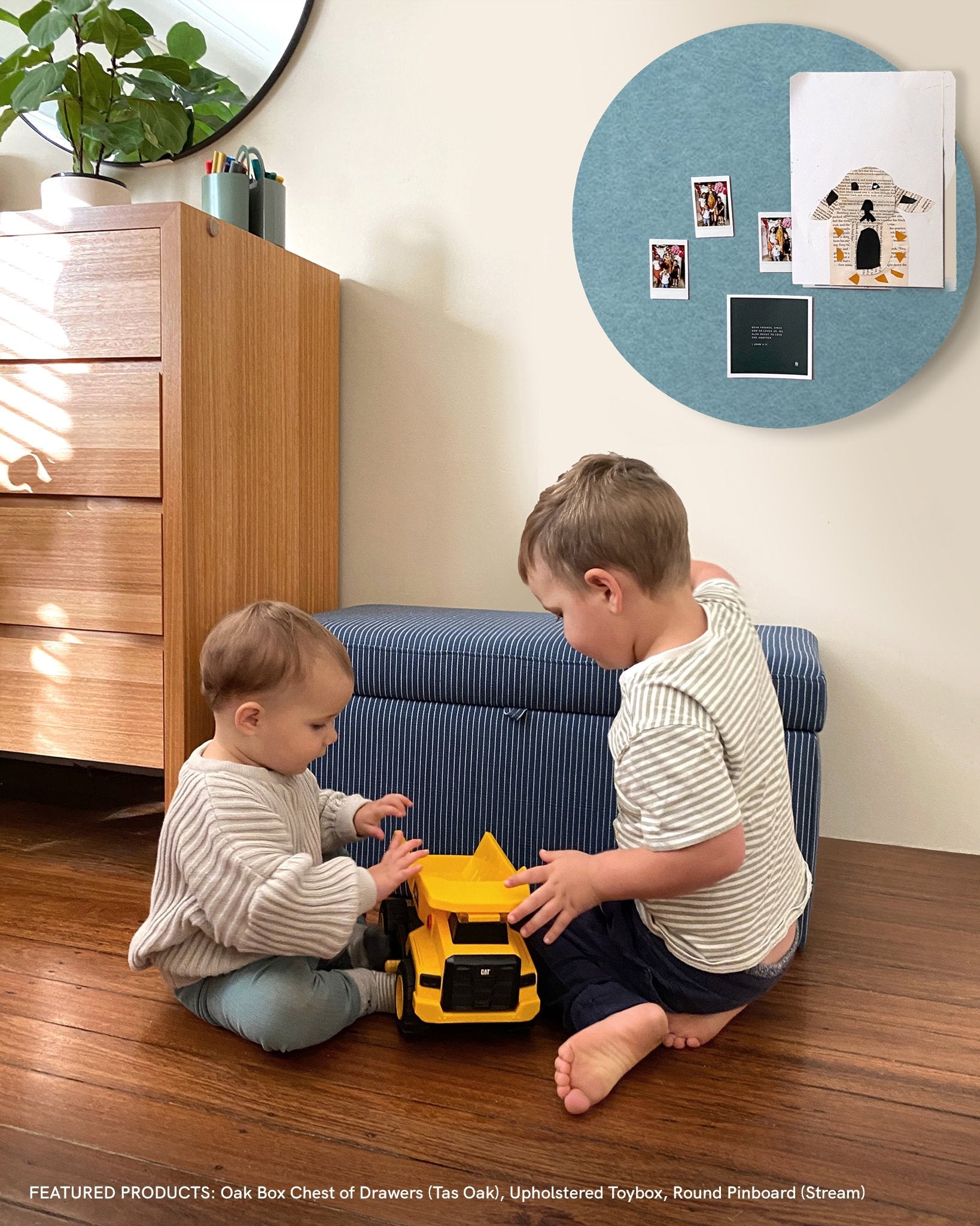 A round Pin board in a kids play corner, used to display family photos and creative artwork