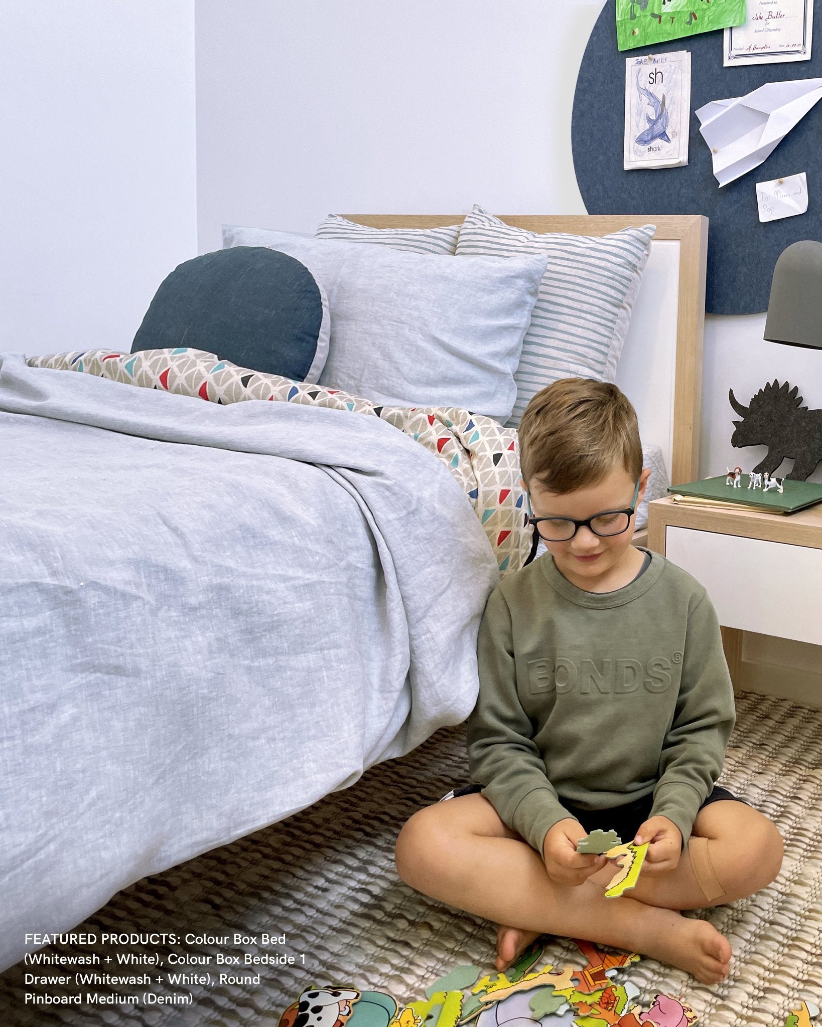 A Large Round Pin Board in a cozy kids' bedroom, used for organizing daily reminders and pinning up creations.