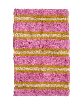 The Stripe bath mat in bubble gum is the bold, modern print you've all been waiting for. This happy, pink hue is complemented by mustard and cream tones to create a fun and graphic statement in your kids bathrooms.