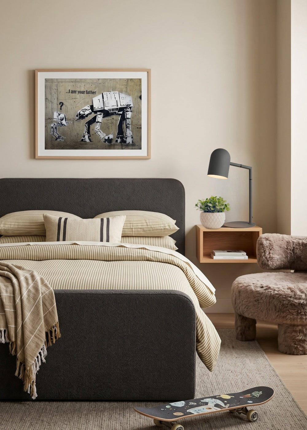A styled bedroom interior featuring a bed with olive bedding, a double Archer Bedhead, a framed black-and-white Star Wars artwork on the wall, a wall mounted bedside table with a charcoal lamp and a plush brown chair. A skateboard rests on the floor in the foreground. Bed and bedside make in Australia by Lilly & Lolly.