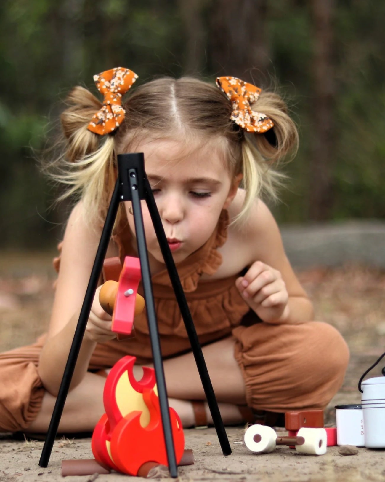 This Camp Fire toy lets your kid's recreate outdoor playtime — in the comfort of your own home if you don't feel like getting your fingers dirty or sleeping bags wet. This set comes complete with tripod to hold the billy can and sits flawlessly above the flames and logs.