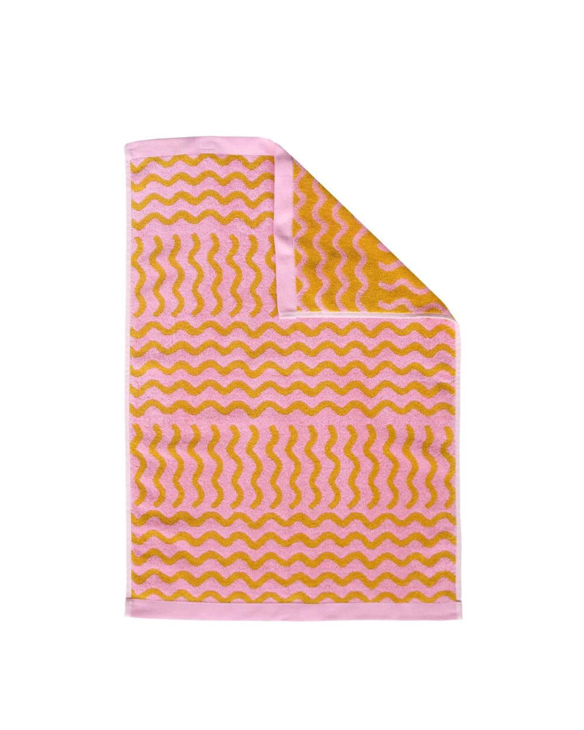 Have a little fun in your bathroom with the Ripple hand towel. Designed with movement in mind, the pink and mustard tones give this graphic print a playful vibe. Designed to bring luxury into the bathroom, this ultra-plush hand towel is made from 100% organic cotton and so much fun.
