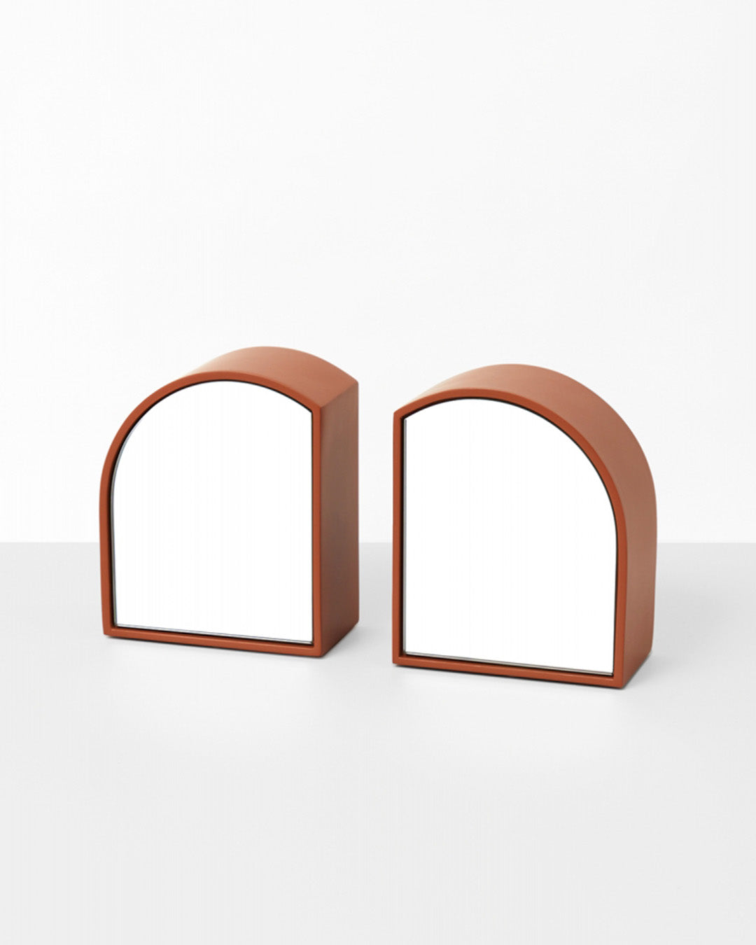 Exploring geometry and reflection, the Archie Bookends are a playful way to add visual interest to a kid's bookcase or desk. Each decorative bookend is double-sided, with a regular mirrored side and a tinted mirror side, allowing for multiple looks and making a feature of your favourite reads.  This product is sold in pairs.