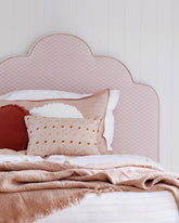 The Bronte Upholstered Bedhead embodies the Australian seaside with its scalloped shaped bedhead. Featuring continuous piping and bold curves, it is sure to make a statement in any kids’ room.    Made to order, Bronte Upholstered Bedhead can be made up in any fabric to suit your home. We offer a range of different styes and textured fabrics from reputable fabric houses. Fabric swatches available on request. Want to see more fabrics? Contact our showroom. 