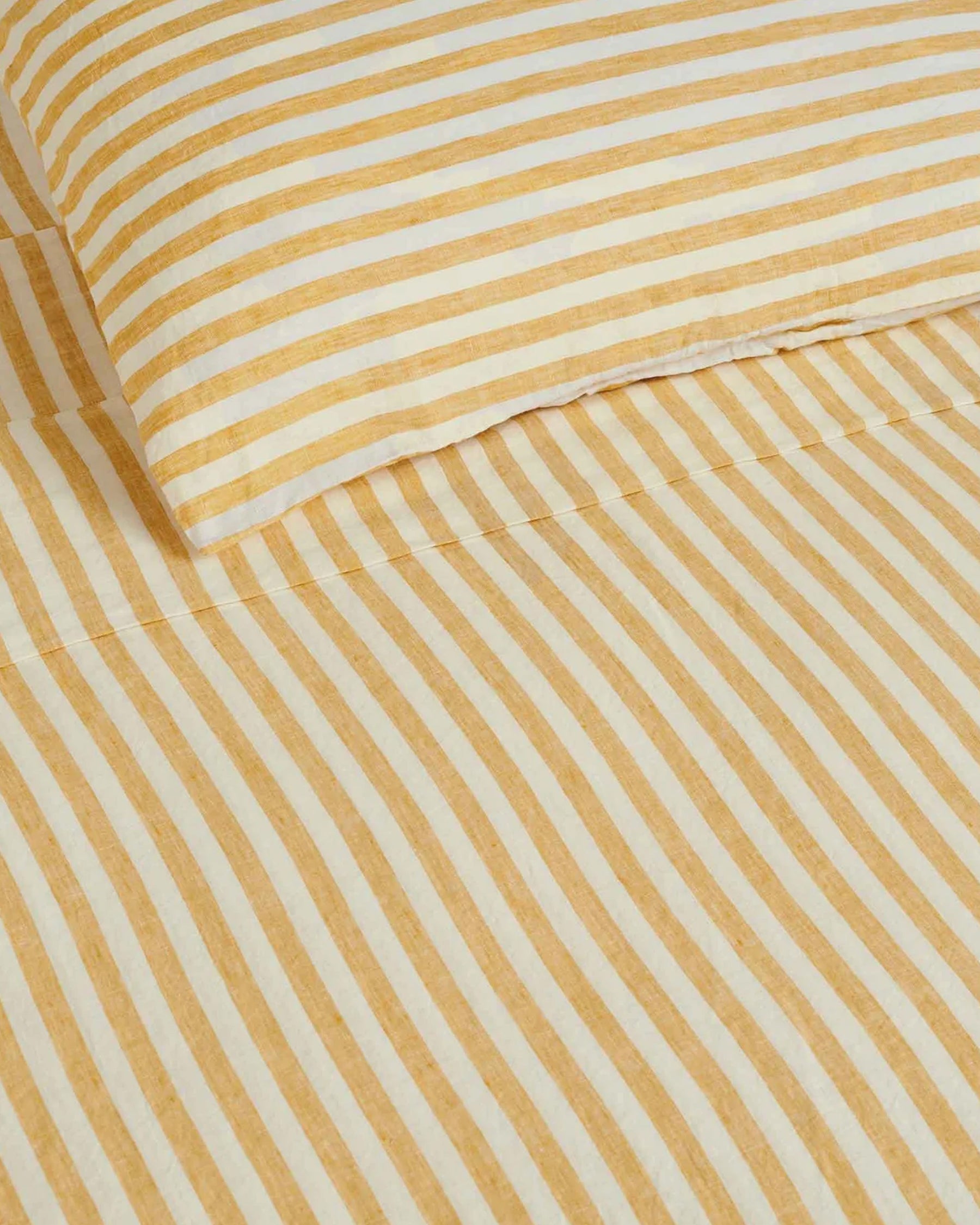 Make your bed your comfiest place with our 100% French linen flat sheet in Wide Natural Stripes. Designed to coordinate with Yellow Stripe Fitted Sheet and Pillowcase to create a sheet set.