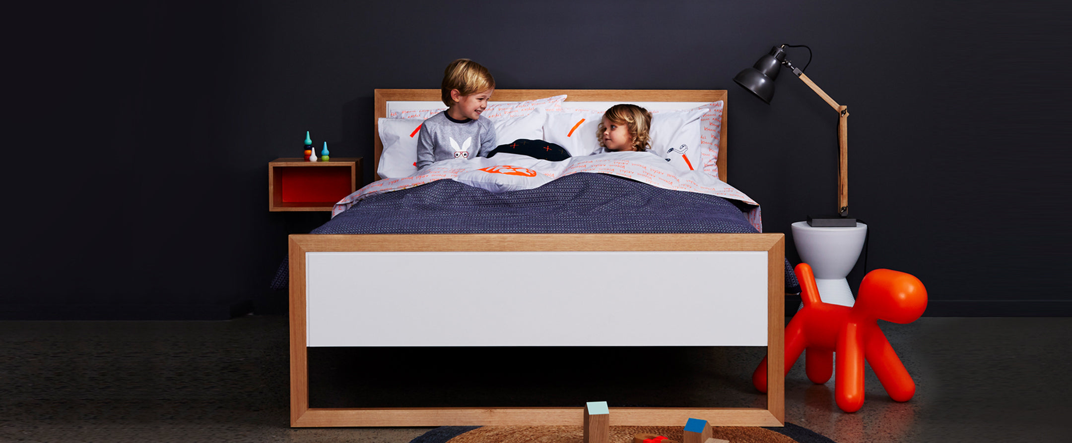 Australian made wooden furniture for kids which is built to last. Classically designed with simple straight edges and colourful panel inserts. Collection includes beds, bedside tables, bookcases, chests of drawers and kids desk.