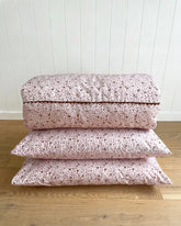 The Daisy Pillowcase features a whimsical all-over daisy print in soft dusty pink and rich cocoa tones. Available in a set of 2.