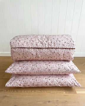 The Daisy Pillowcase features a whimsical all-over daisy print in soft dusty pink and rich cocoa tones. Available in a set of 2.