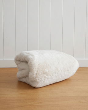 The Hare Throw is crafted from our ultra-soft faux fur and feels incredibly silky and plush — just like cuddling a bunny rabbit. Colour: Sienna Snow.