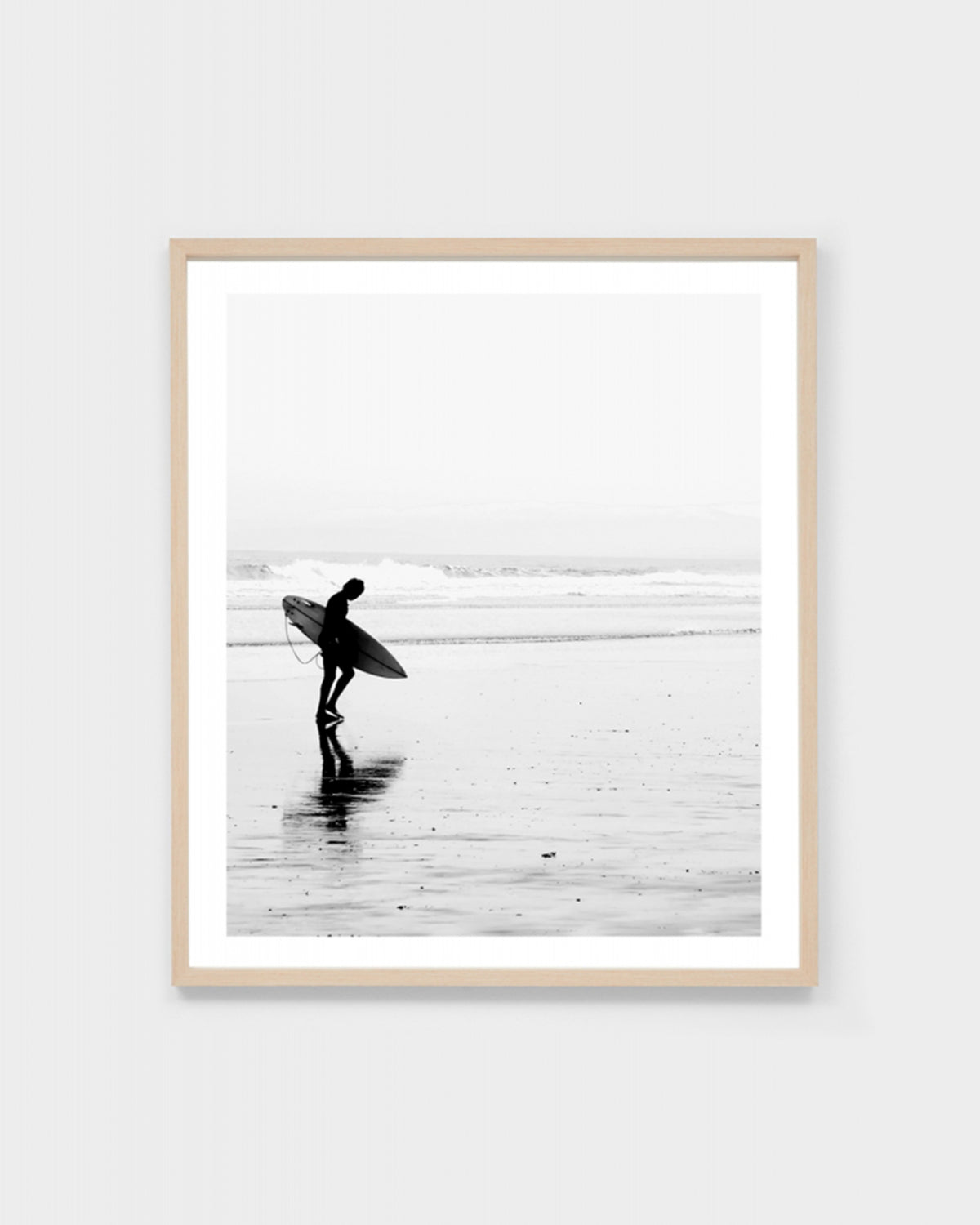 A stunning monochrome coastal print that will make a statement in any young surfer's room.  This Morning Surf framed print comes with a white (unprinted) 5.5cm border on all sides around the artwork.  Timber frame, glass, engineered wood backing.