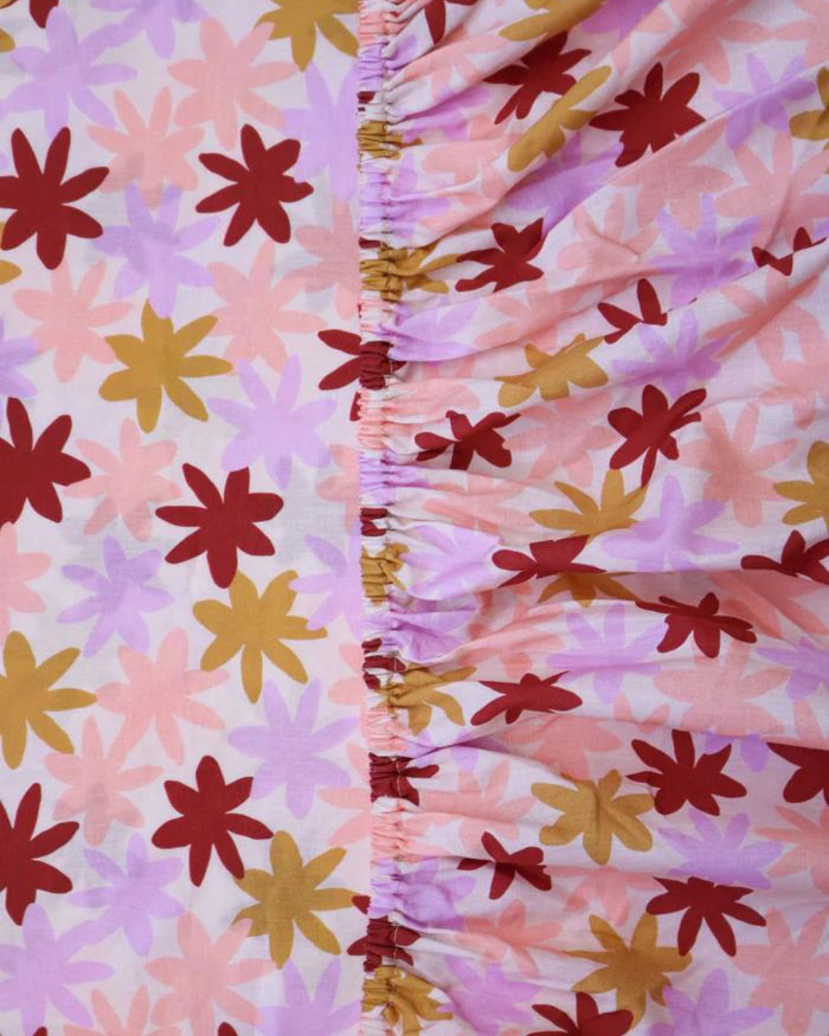 Your kids will sleep soundly on this gorgeous Peach Floral Fitted Sheet. Made from 100% combed cotton percale for a soft texture, this sheet features a graphic floral pattern in a palette of burgundy, soft lilac, sweet peach and warm caramel.