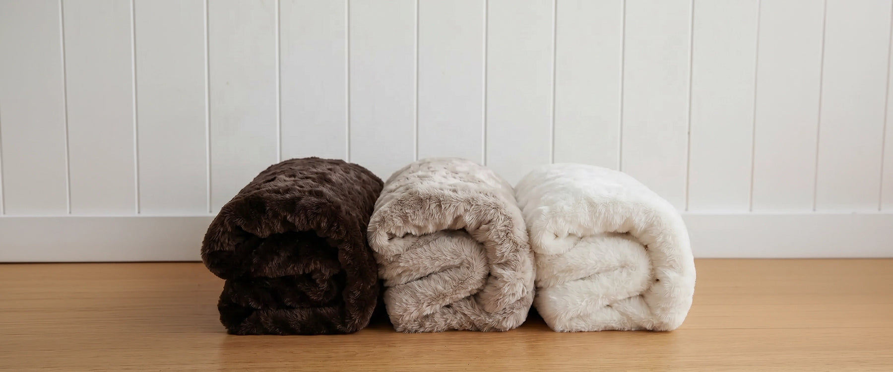 Shop bedding throws and blankets. Image shows the Hare Throw, part of Lilly & Lolly's Daisy Collection which includes sheet set, duvet set, pillowcases, cushions, throws and matching daisy ottoman.
