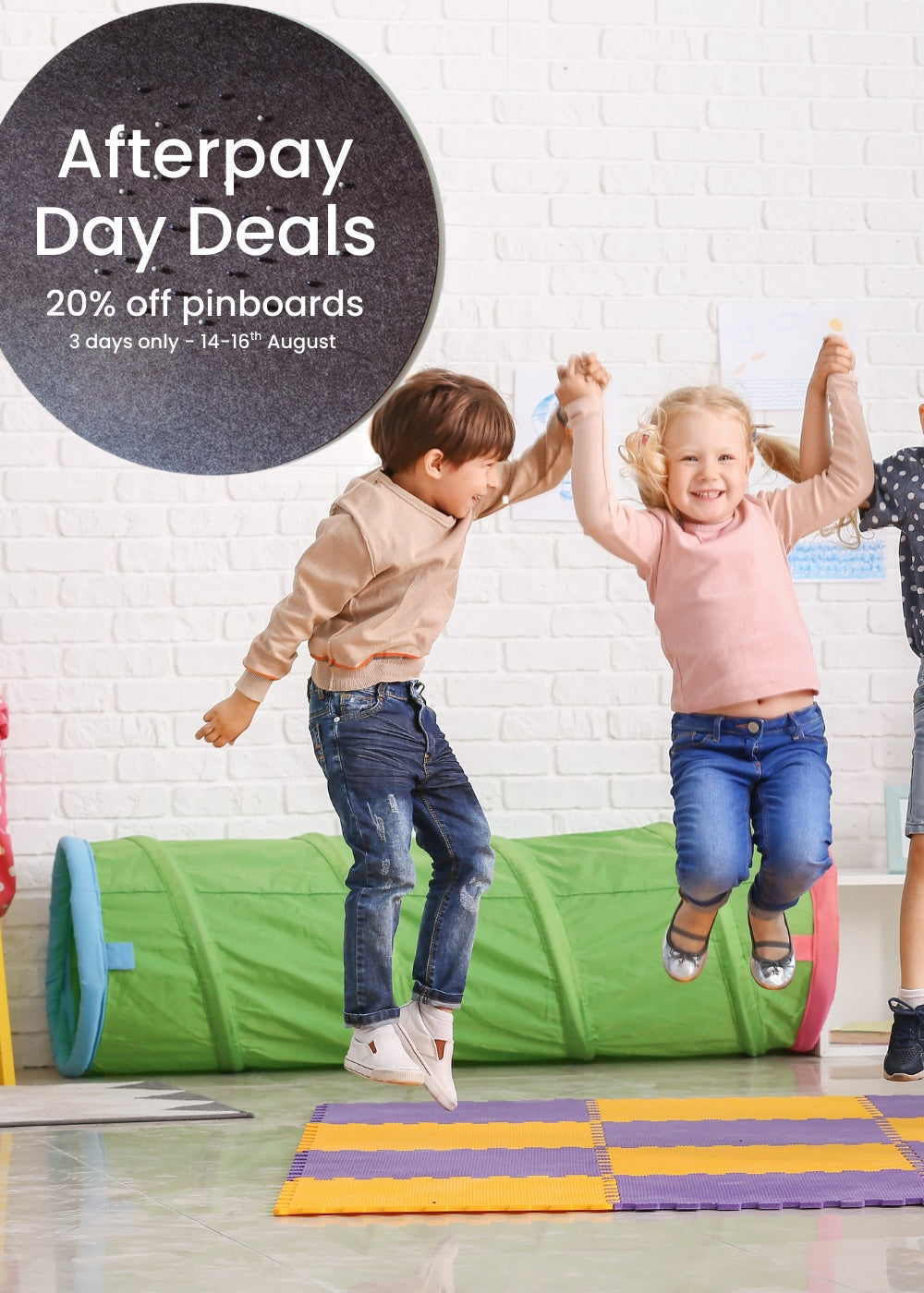 Children playing in a playroom jumpring with joy  with promotional text for Afterpay Day Deals.