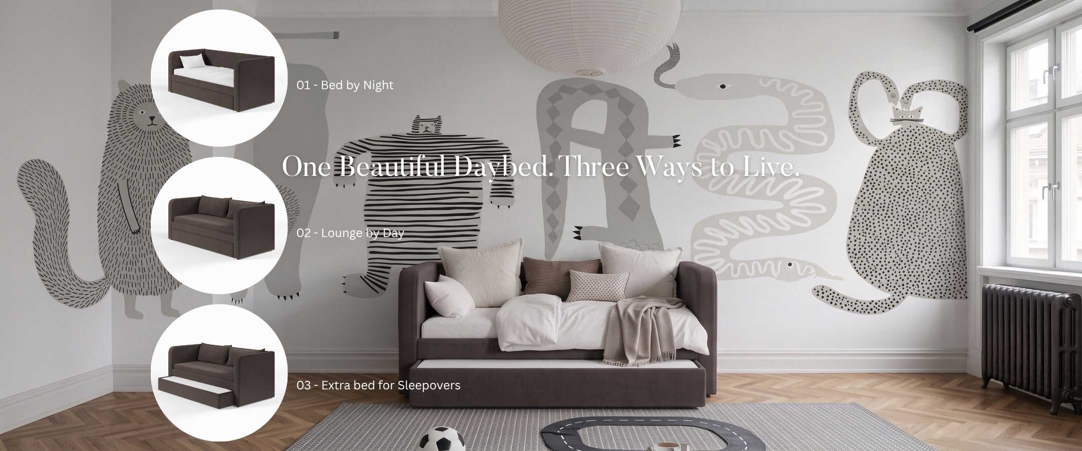 A styled bedroom scene showing a dark brown daybed with white bedding in a modern room, with three circular inset views on the left showing different styling options for the daybed. First is bed by night, the second is lounge by day and the third is showing a trndle bed pulled out as an extra bed for guests. The room has a large animal silhouette mural on the wall, and a window.