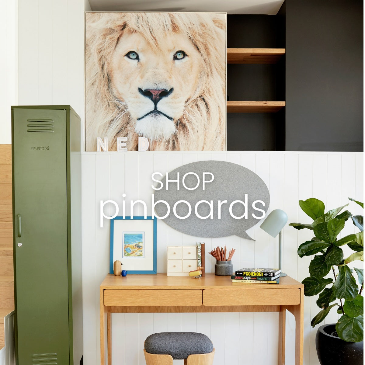 Home office interior featuring a timber desk and felt pinboard in grey. Shop Pinboards banner.