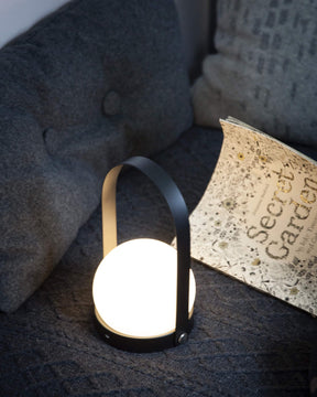 Designed as a portable, lightweight lamp, the Carrie LED Lamp is unique for its multiple uses and wonderful for kids’ rooms.  With a sleek, functional handle and a warm orb of light nestled gently in a basket-like base, the lamp is useful almost anywhere; even on the go, as it is cordless and comes with a USB charger. Move it from your office to your bedside table, to your evening picnic in the park and in your bicycle basket as you ride home.