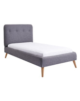 Our Charlie Upholstered Bed is designed to create a sense of warmth and comfort. Its features include fine piping which encases the soft curved bed head, bold buttons, and it is finished with hand turned angled legs.  Made to order, the Charlie Bed can be made up in any fabric to suit your home. We offer a range of different styes and textured fabrics from reputable fabric houses. Fabric swatches available on request. Want to see more fabrics? Contact our showroom. 