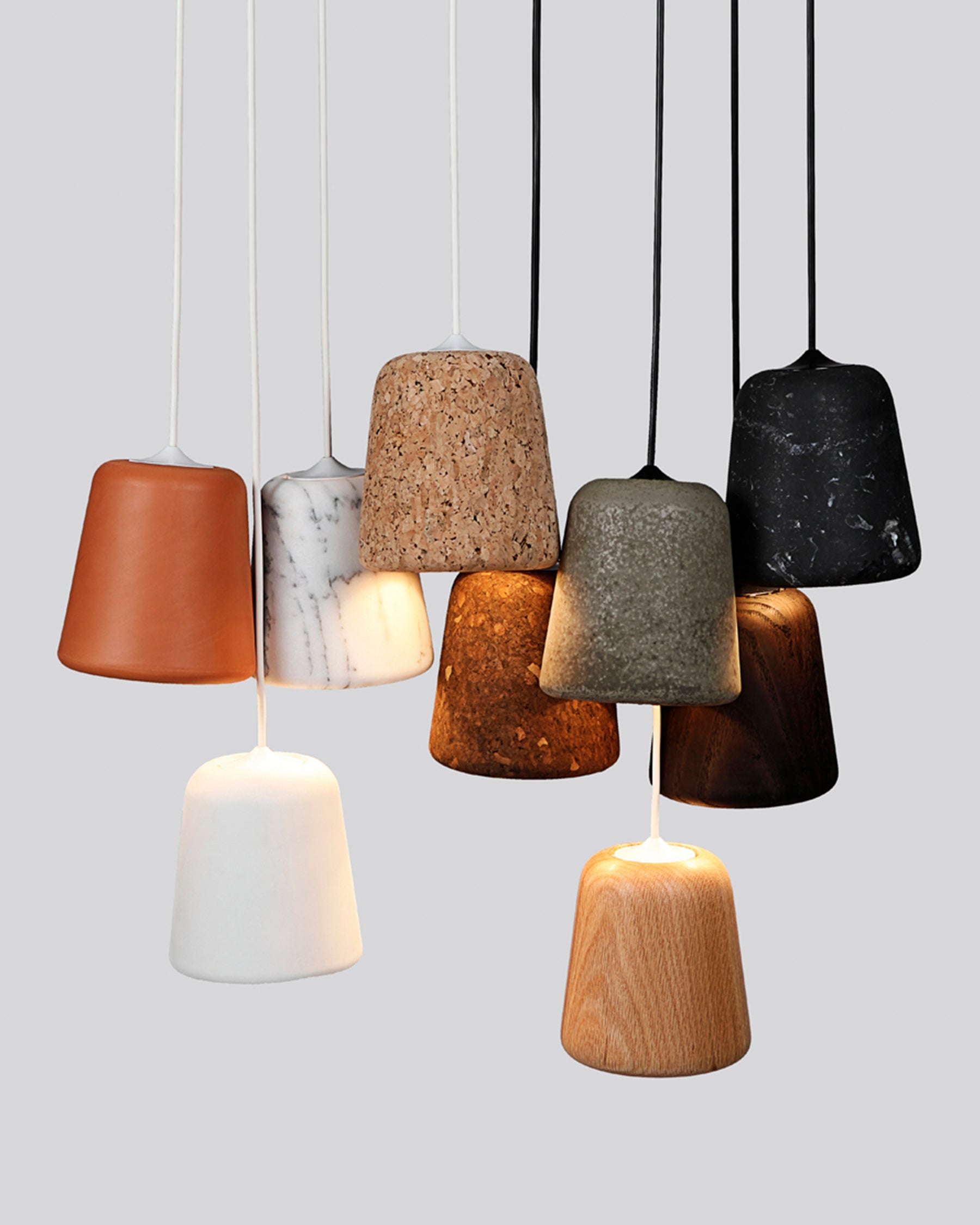 The Material Pendant highlights the power of simplicity in form.  Through this simplicity, it can become a standout piece within a kid's room, or be used to complement those around it. From the warmth of oak and cork, to the roughness of concrete and marble, the richness of terracotta, and the radiance of yellow steel, the Material Pendant offers a versatile addition to any space.  Shade: H: 14 X Ø: 13 cm  PVC Cord: 290cm