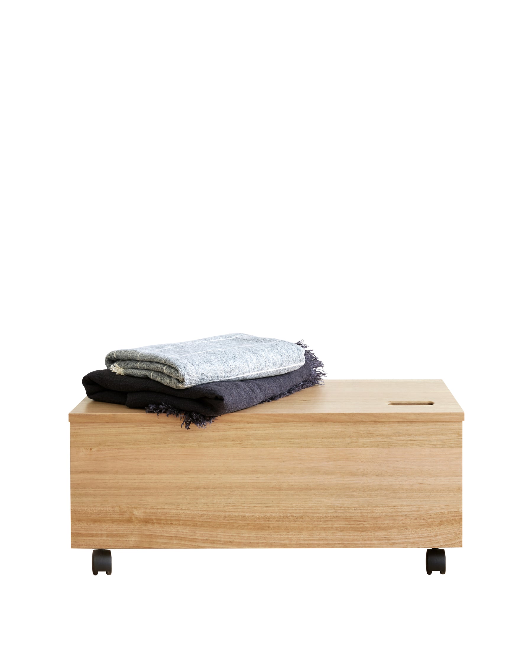 Scoop Toy Box is a spacious storage box for kids to pack away toys and treasures. Neatly carved out handle atop for easy lifting with an internal gas-lift hinge to ensure that the box closes gently to protect fingers. This solid oak, handcrafted toy box is perfect to move from room to room and its fine finish makes it perfect in any space.